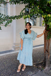 Flowy light blue midi dress with tie waist and tiered hem