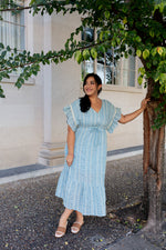 Flowy light blue midi dress with tie waist and tiered hem