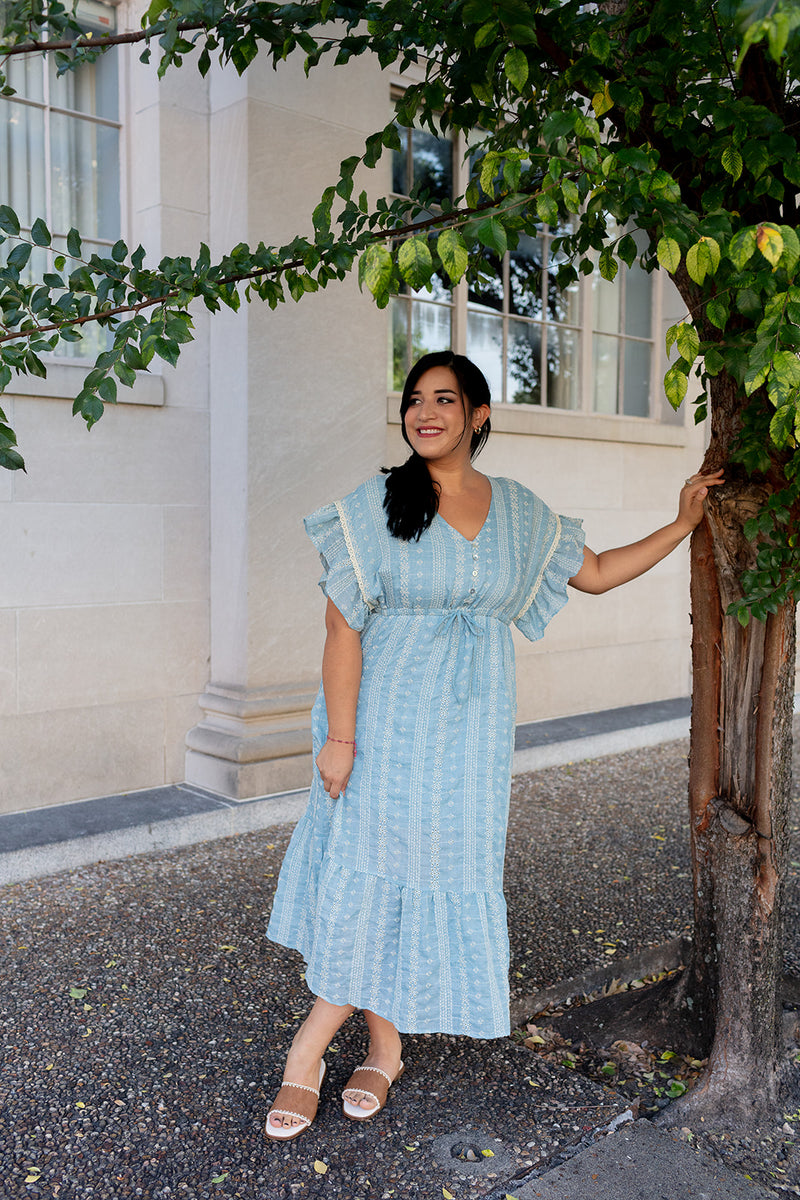 Flowy light blue midi dress with tie waist and tiered hem
