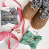 Brown shoes with 'Game Day' accessories, including bows and ribbons, on a white background.