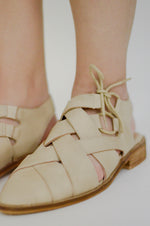 The Tucson Woven Flats in Sand
